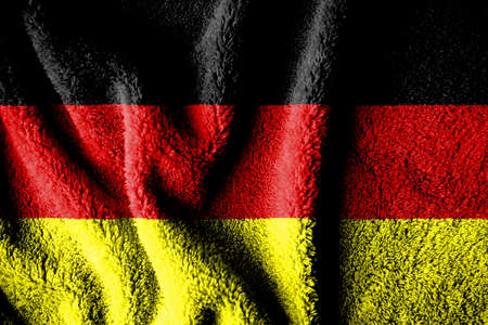Towel fabric pattern flag of Germany. The texture of the wrinkled surface of the fabric. Close-up view.の写真素材