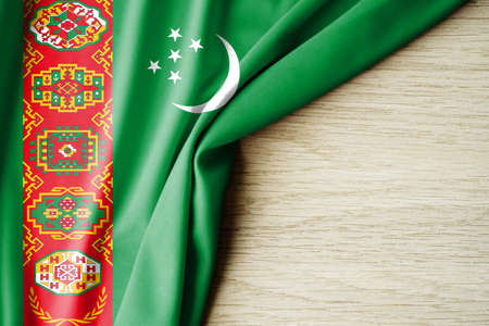 Turkmenistan flag. Fabric pattern flag of Turkmenistan. 3d illustration. with back space for text. Close-up view.の写真素材