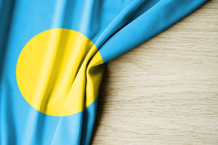 Palau flag. Fabric pattern flag of Palau. 3d illustration. with back space for text. Close-up view.の写真素材