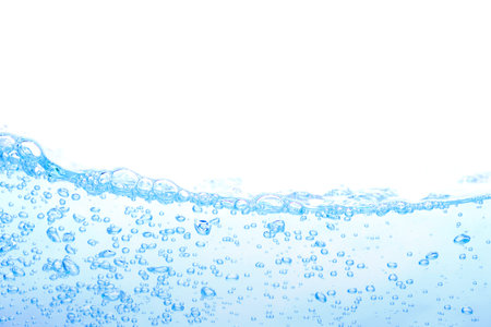 The surface of the water. White background. Movement. Close-up view.