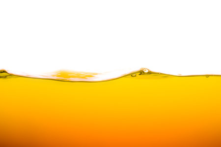 <p>orange juice is isolated on white background. healthy fresh drink and natural waves. close up view.</p>の写真素材
