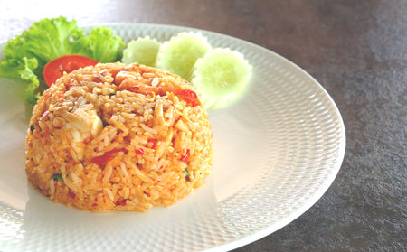 Tom Yum Fried Rice. Great tasting Thai food. On an old cement table. Close-up view.の写真素材