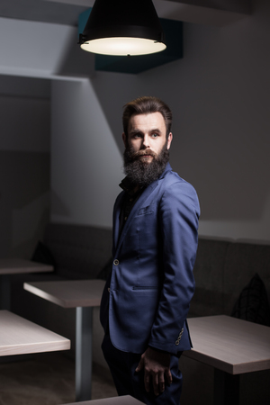 charismatic bearded man dressed in suit;の写真素材