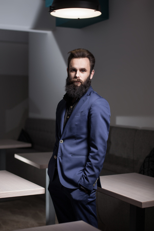 charismatic bearded man dressed in suit;の写真素材