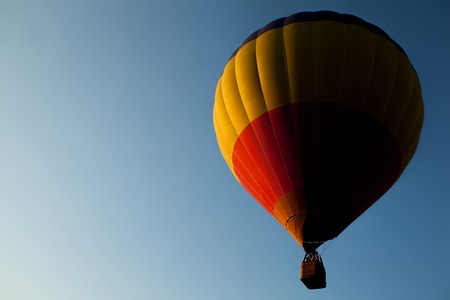 air balloon flying in clear blue sky; aircraft flies high in atmosphere;の写真素材
