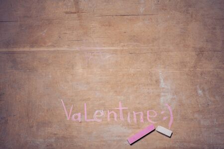 celebrative postcard painted with chalk; valentines day on wooden background;の写真素材