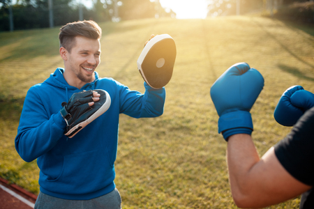 boxing outdoor workout with trainer;の写真素材