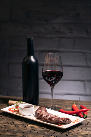 tasty food on wood with vegetables and alcoholの写真素材