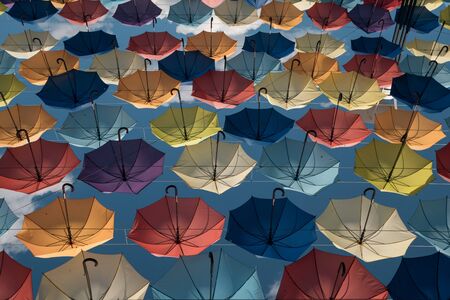 wallpaper with umbrellas in clear blue skyの写真素材