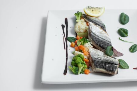 healthy sea food with lemon, basil, cauliflower and carrotsの写真素材