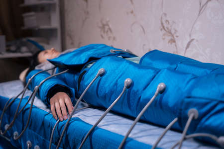 modern pressotherapy machine for anti cellulite procedure in spa salonの写真素材