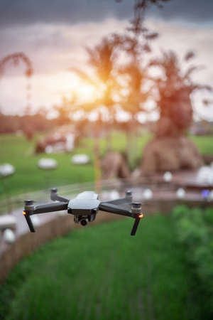 professional drone flying over ancient stone idol monumentの写真素材