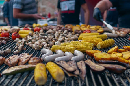 grilled vegetable and meat on barbecue at food fest or festival outdoorの写真素材