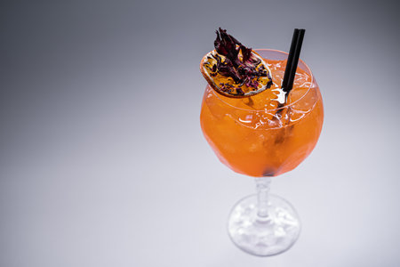 close up of orange   lychee cocktail in glass on white backgroundの写真素材