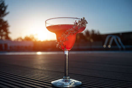 hemingway daiquiri cocktail drink with grapefruit in glass outdoor at sunsetの写真素材