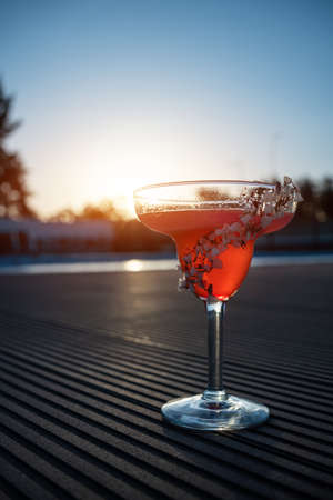 hemingway daiquiri cocktail drink with grapefruit in glass outdoor at sunsetの写真素材