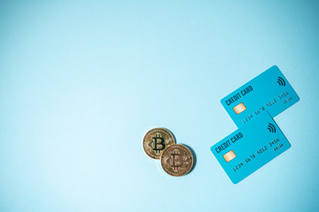 bitcoin cryptocurrency coin with credit bank card concept of online paymentの写真素材