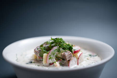 close up of russian traditional cold soup okroshka in bowl on black backgroundの写真素材