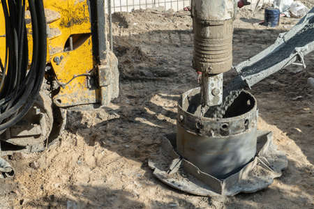 pile driver heavy machinery for concrete pouring at constructionsの写真素材