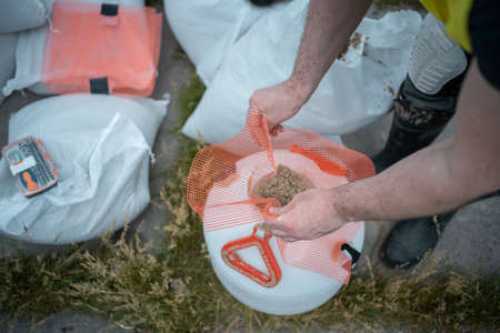 worker prepare mix with water and sand for sandblasting jet cleanerの写真素材