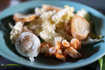 fresh and delicious caesar shrimp salad with lettuce and crusty crouton toastsの写真素材