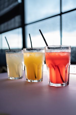 glasses set with fruit fresh colored juice of berry, lemon, ginger, strawberryの写真素材