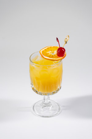 fresh tequila sunrise orange cocktail with slice of citrus isolatedの写真素材