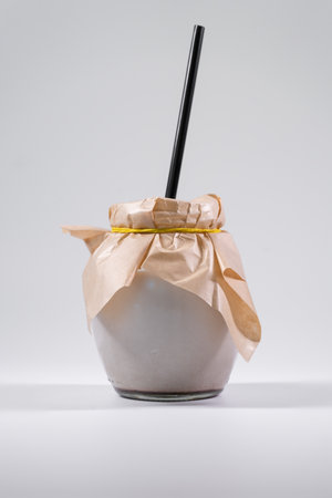 bowl with chocolate yogurt or dairy product, milkshake isolated on whiteの写真素材