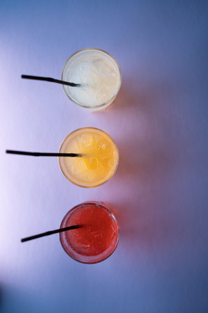 glasses set with fruit fresh colored juice of berry, lemon, ginger, strawberryの写真素材