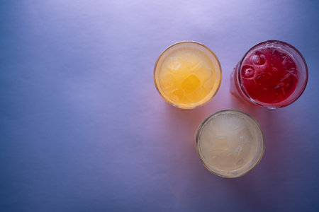 glasses set with fruit fresh colored juice of berry, lemon, ginger, strawberryの写真素材