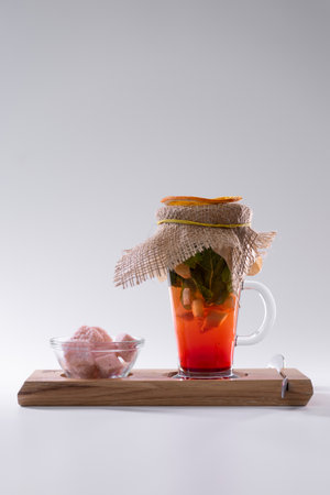 fresh vitamin red ginger tea cup with strawberry, mint, pink sugar isolatedの写真素材