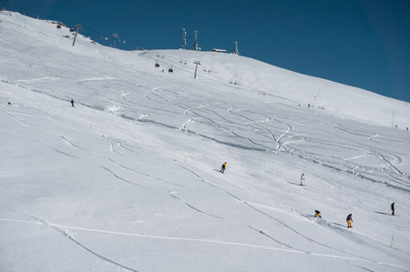 ski and snowboarding at winter mountains on trackの写真素材