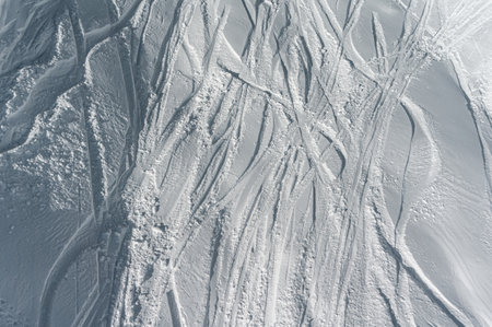 deep trace from ski and snowboard on snow winter mountain slope, freerideの写真素材