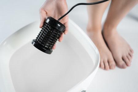 procedure of ionic detox foot bath machine in spa beauty center isolatedの写真素材