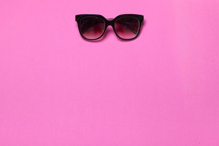 luxury fashionable sunglasses on pink and purple background, flatlay top viewの写真素材