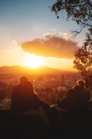 romantic lovely couples watch beautiful sunset in Malaga, Spainの写真素材