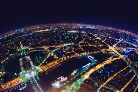 aerial view of illuminated night city panorama of Paris with street lights, drone top view from...