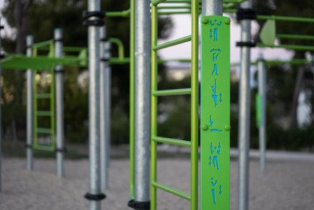 street fitness park for workout and calisthenics area, sport equipment with bars for push and pull...