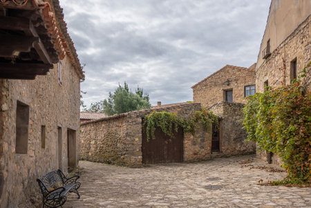 cozy narrow streets of ancient Roman town Medinaceli showcase ancient cobblestone architecture and peaceful ambianceの写真素材