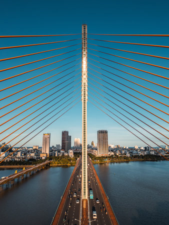 Symmetric modern cable-stayed bridge over Han River in Da Nang, Contemporary urban span connecting...