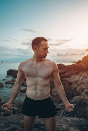 Athlete showcases strength and nature challenge, Muscular athletic climber man radiates fitness and rugged successの写真素材