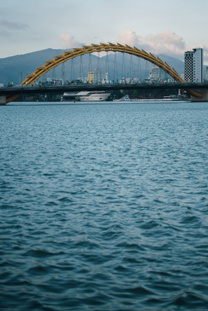 Dragon Bridge crossing Han River in Danang at sunset, iconic Vietnam city landmark, Famous Dragon...