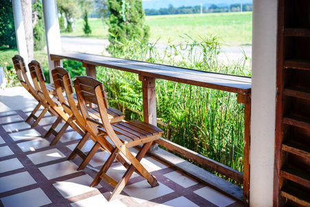 chairs and counter on sunny at cafeの写真素材
