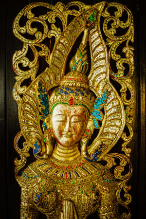 Traditional Thai Art on Temple doorの写真素材