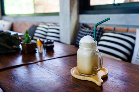 Cappuccino Iced coffee on wood tableの写真素材
