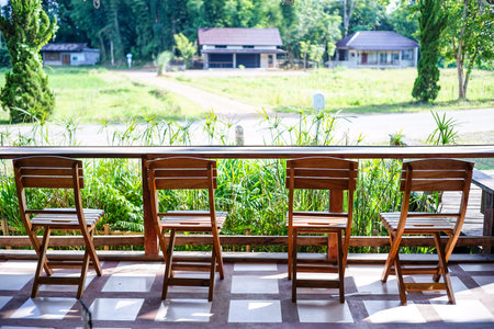 chairs and counter on sunny at cafeの写真素材