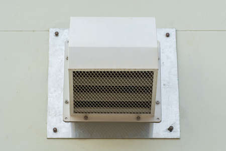 Ventilator with insect screen on the wallの写真素材