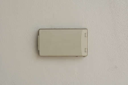 Weatherproof outdoor light power switch on the wallの写真素材