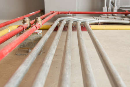 Steel Conduits with support on floorの写真素材