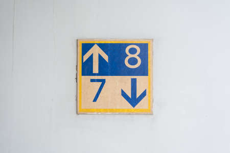 Floor signs showing the directions to upper and lower floorの写真素材